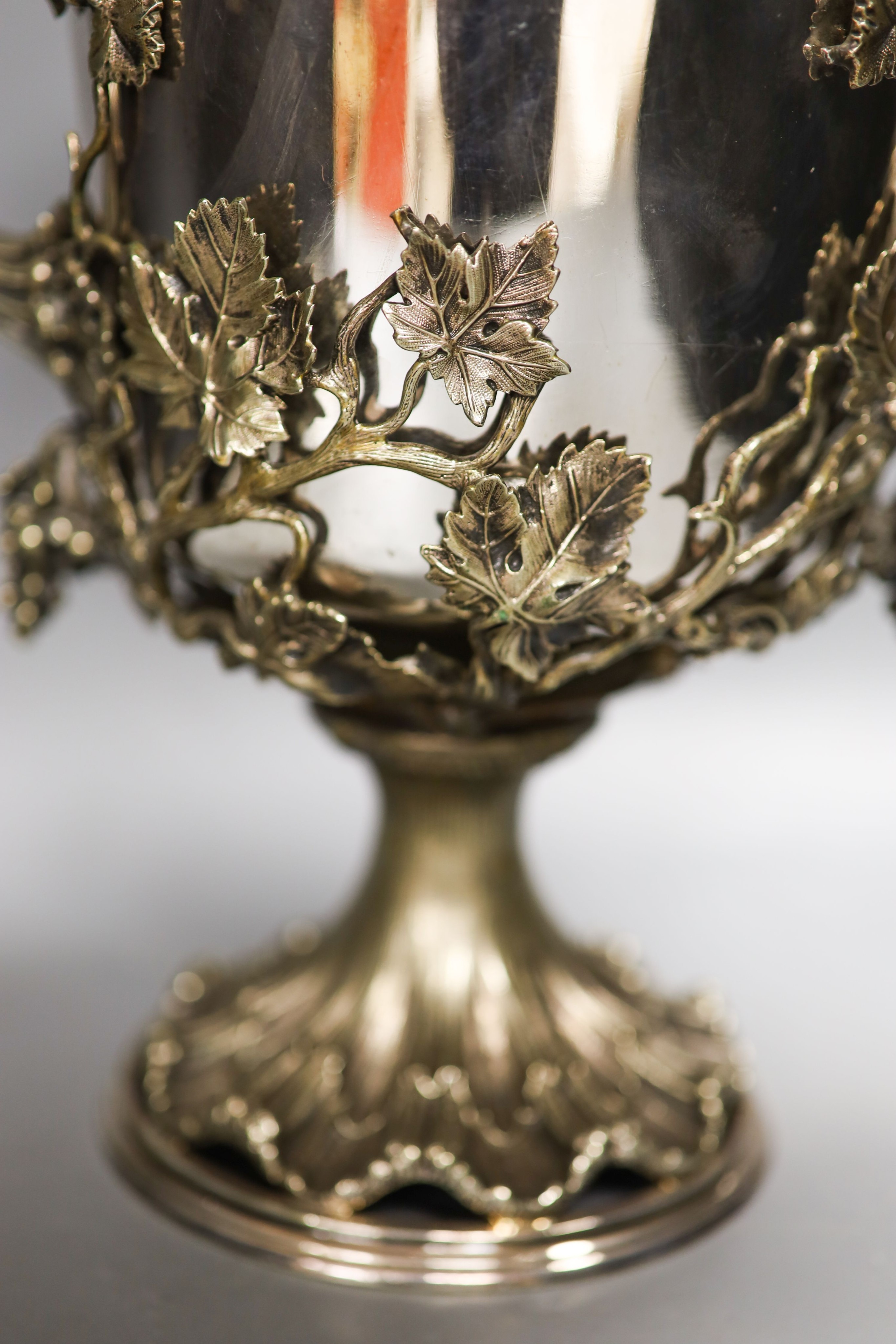 A Victorian campana shaped plated wine cooler, cast with fruiting vines 28cm